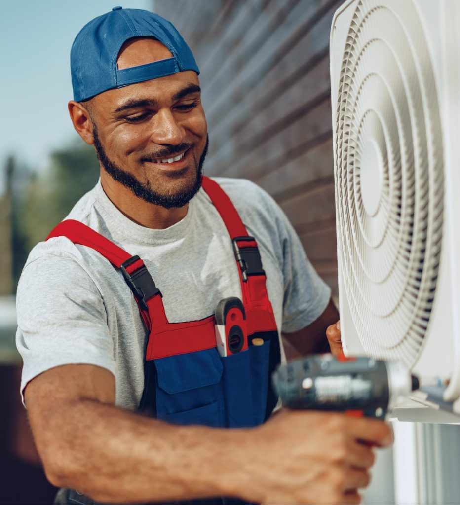 Inman Heating & Cooling possible repairman installing an outdoor air conditioner unit